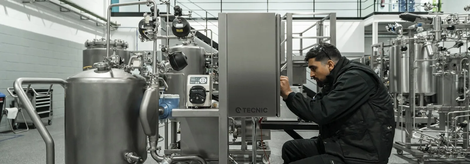 technician servicing pipeline equipment